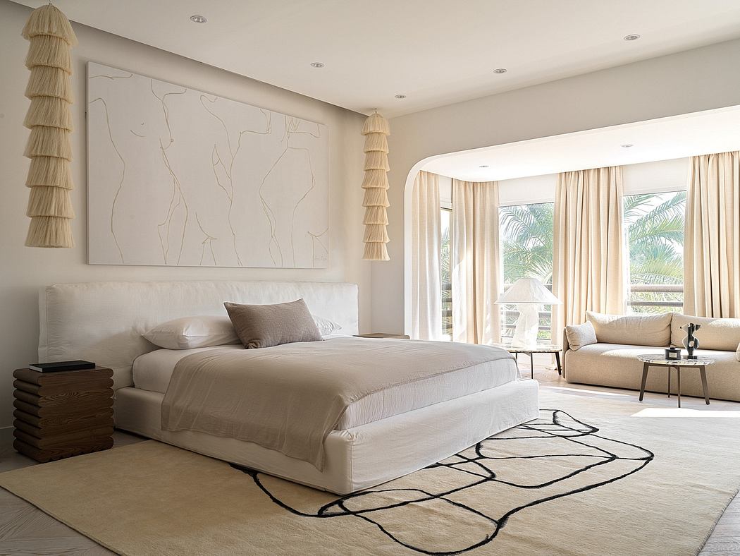 Spacious modern bedroom with neutral color palette, large bed, and abstract wall art.