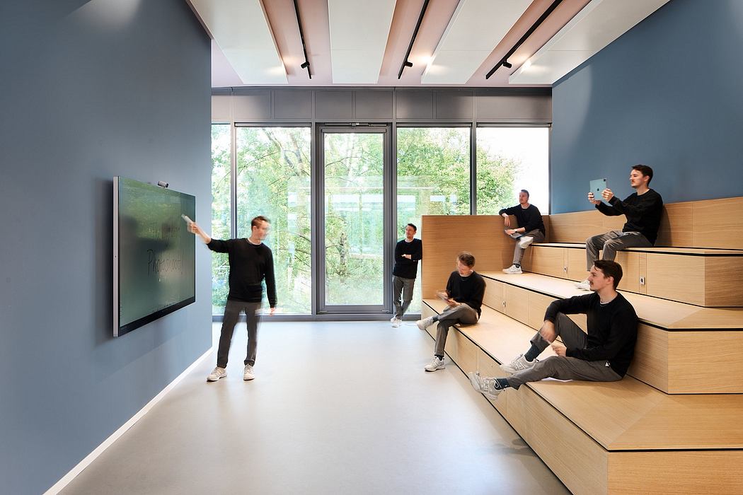 A modern, minimalist interior with large windows, wood-paneled seating areas, and a projector screen.