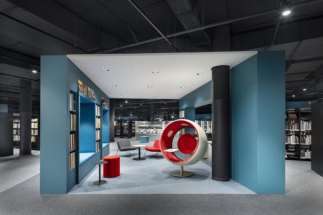 Striking modern interior with bold red furnishings, geometric shapes, and neutral tones.