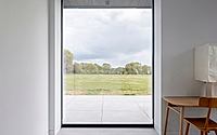 015-weald-house-mirrors-remote-kent-meadows-with-sleek-roof-tiles.jpg