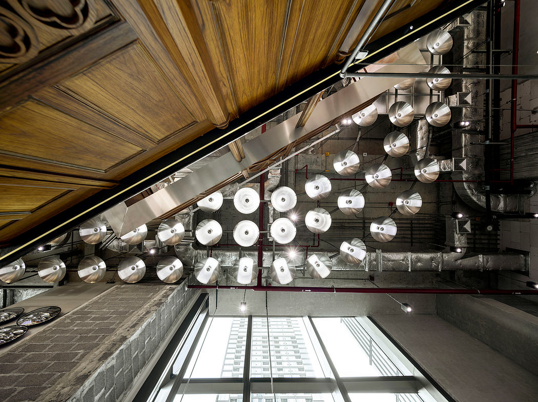 Intricate lighting fixtures and wooden architectural details in an interior space.