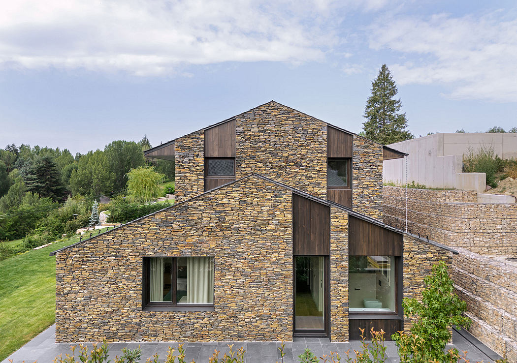 Striking stone and wood exterior with contemporary architectural features.