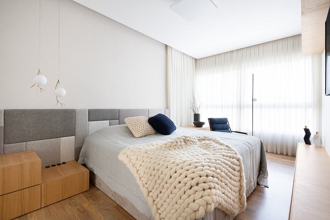 Minimalist bedroom design with plush textures, open layout, and modern furnishings.