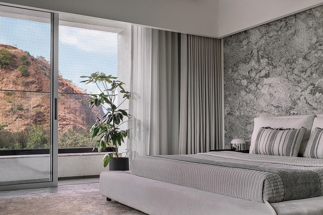 Sleek modern bedroom with floor-to-ceiling windows, textured gray walls, and minimalist decor.