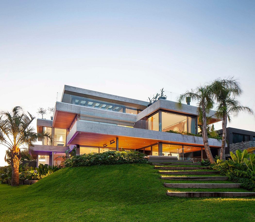 Striking modern architecture with wood accents, expansive windows, and lush landscaping.