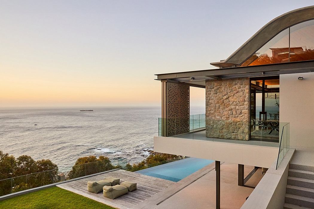 Striking modern home with panoramic ocean views, infinity pool, and glass walls.