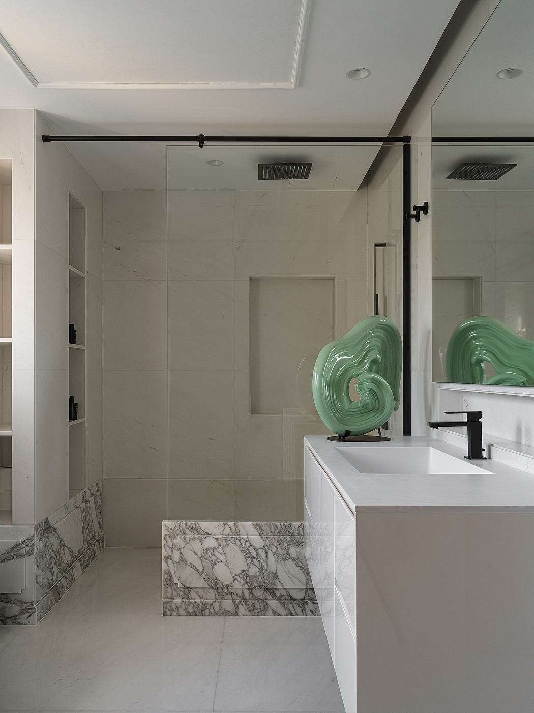 A modern bathroom with sleek white vanity, marble accents, and a striking mint-colored sculpture.