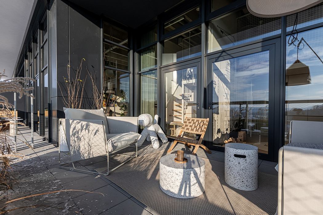 Modern and minimalist exterior with glass walls, sleek furniture, and sculptural accents.