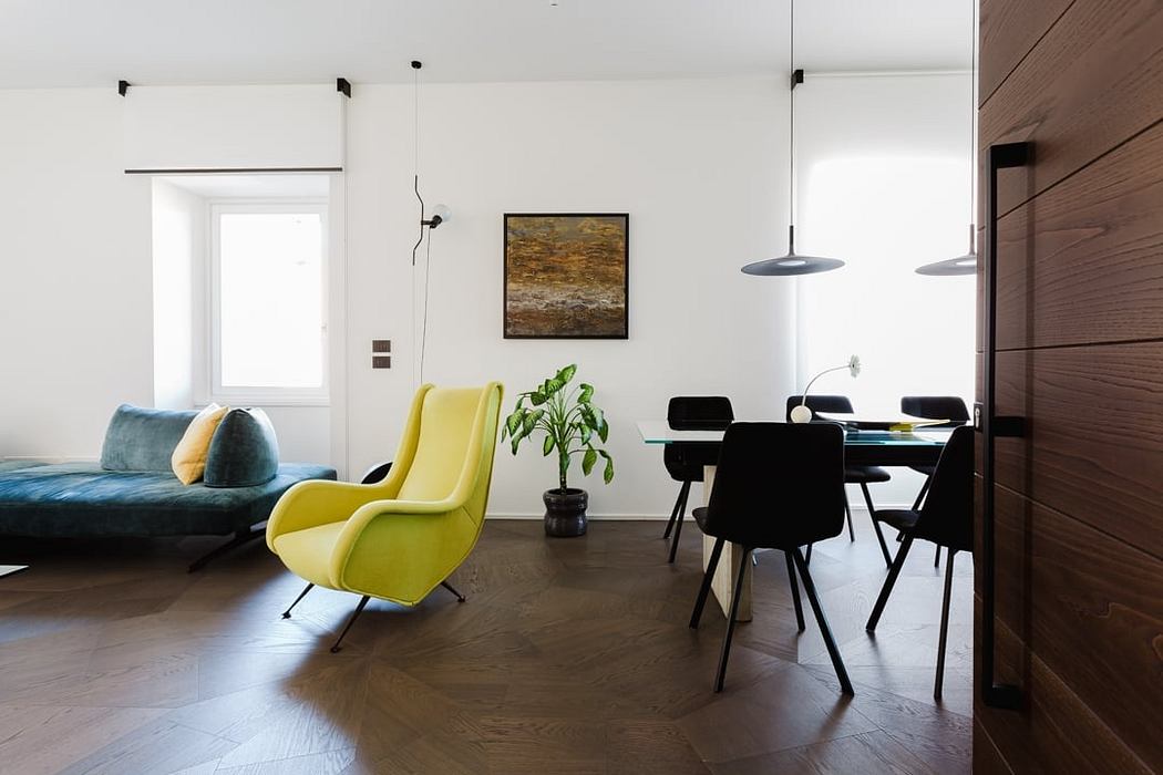 Spacious open-concept living area with modern furnishings, wood accents, and artwork.