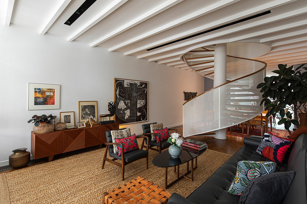 Spacious living room with wooden beams, spiral staircase, and eclectic decor.