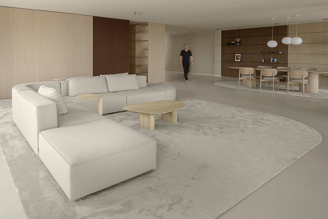 Spacious modern living room with minimalist furniture, wood accents, and recessed lighting.