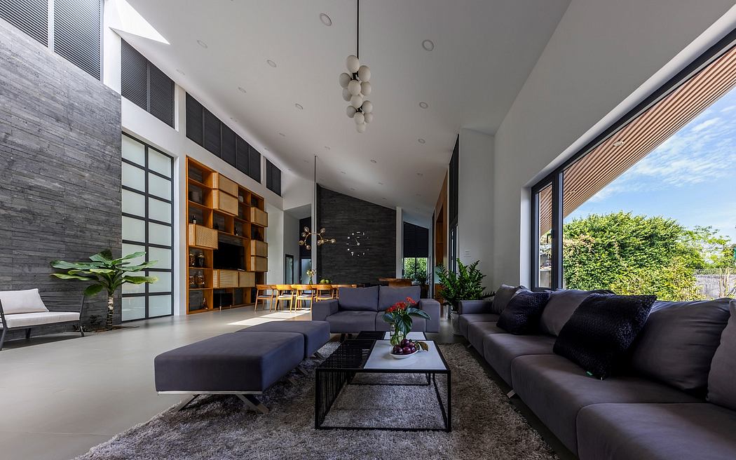 Sleek, modern living room with minimalist furniture, high ceilings, and large windows.