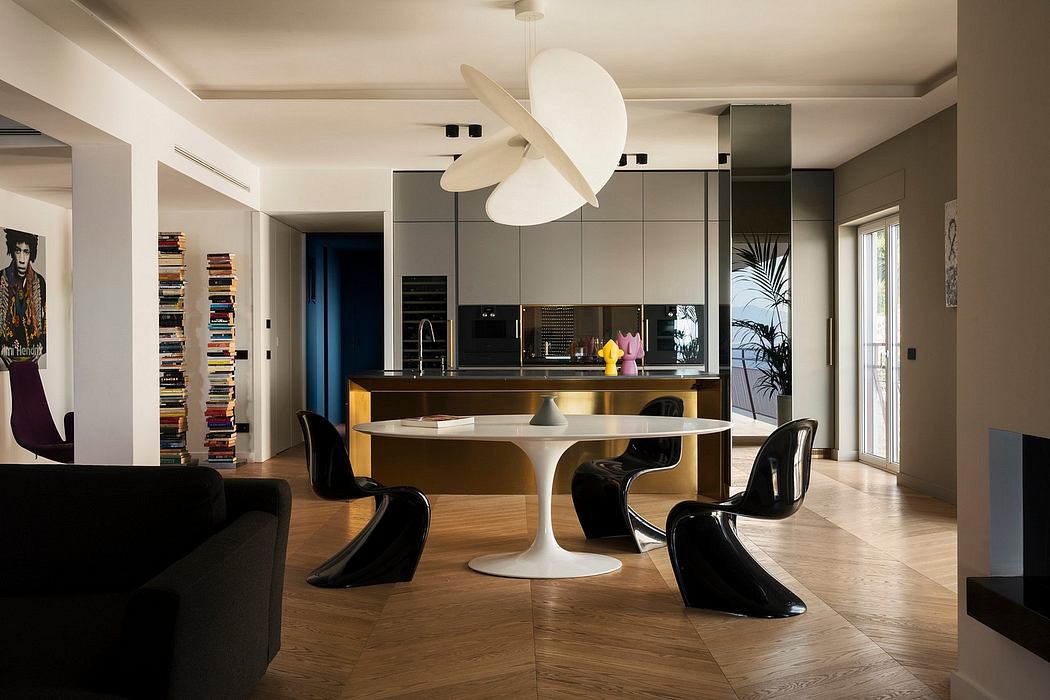 Modern open-concept kitchen-dining area with Panton chairs, wood floors, and circular pendant light.
