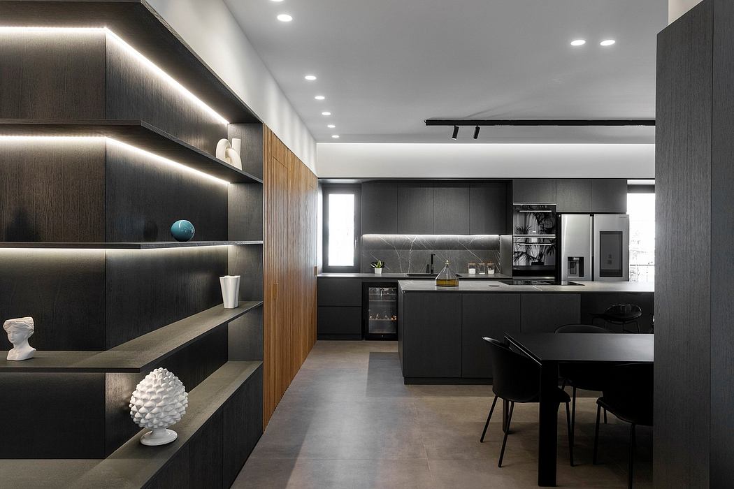 Sleek, modern kitchen with dark cabinetry, wooden accents, and recessed lighting.