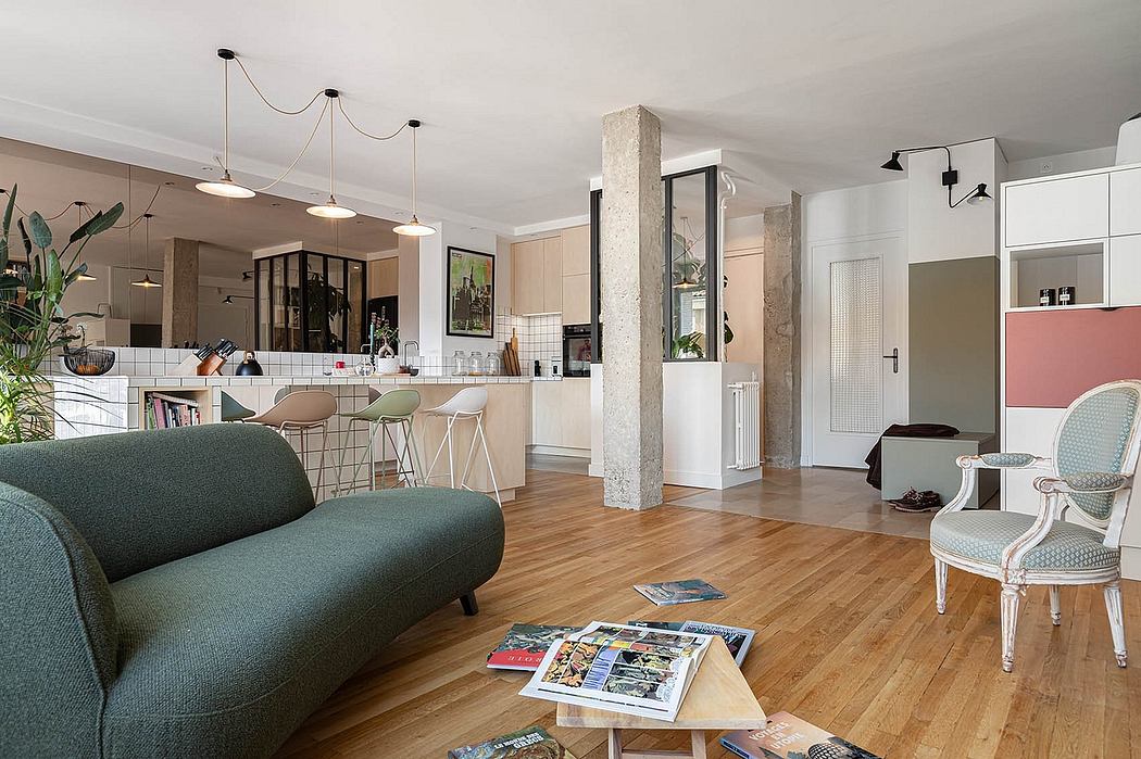Open-concept living space with modern kitchen, wood floors, and eclectic furniture.