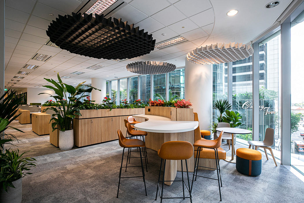 Modern office space with unique wood and metal furniture, plants, and lighting fixtures.