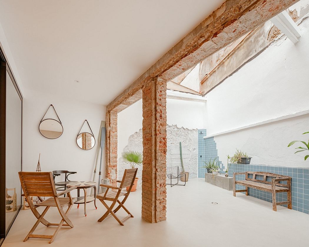 Minimalist interior with exposed brick walls, wooden furniture, and modern decor.