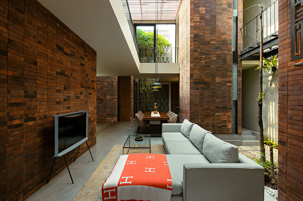 Minimalist indoor space with wooden walls, sleek furniture, and natural light from above.