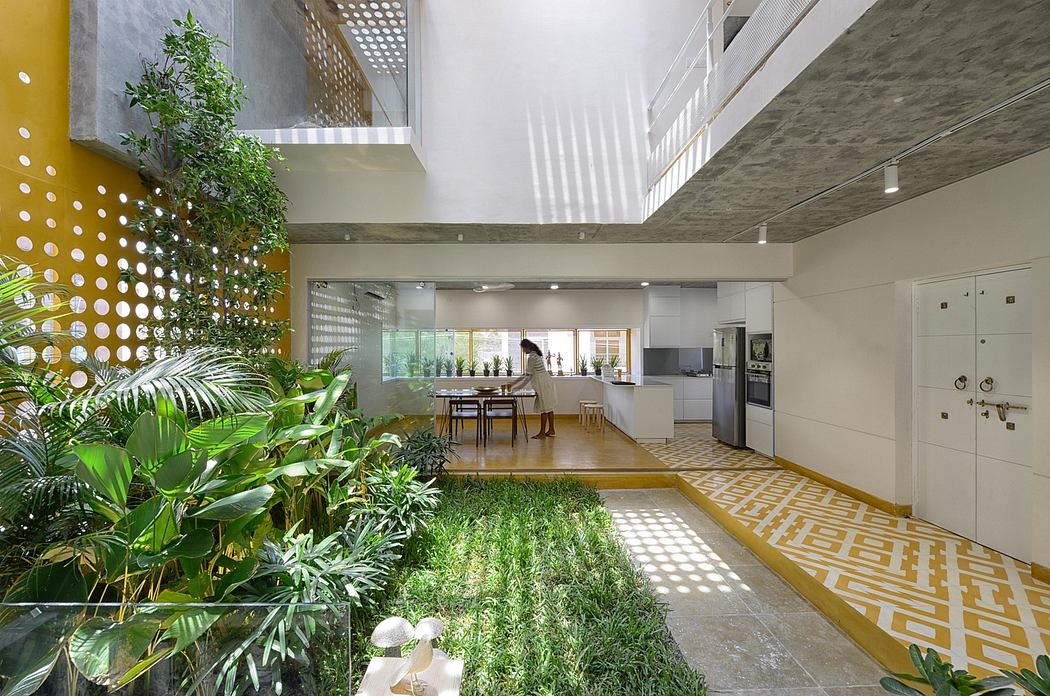 Vibrant indoor garden with patterned floors and natural lighting in modern apartment.