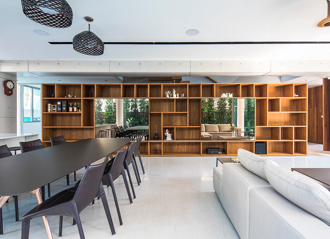 Striking contemporary interior with expansive wooden shelving, dining, and living areas.