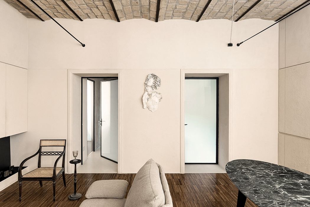 Elegant, minimalist interior with stone walls, wooden floors, and modern furnishings.