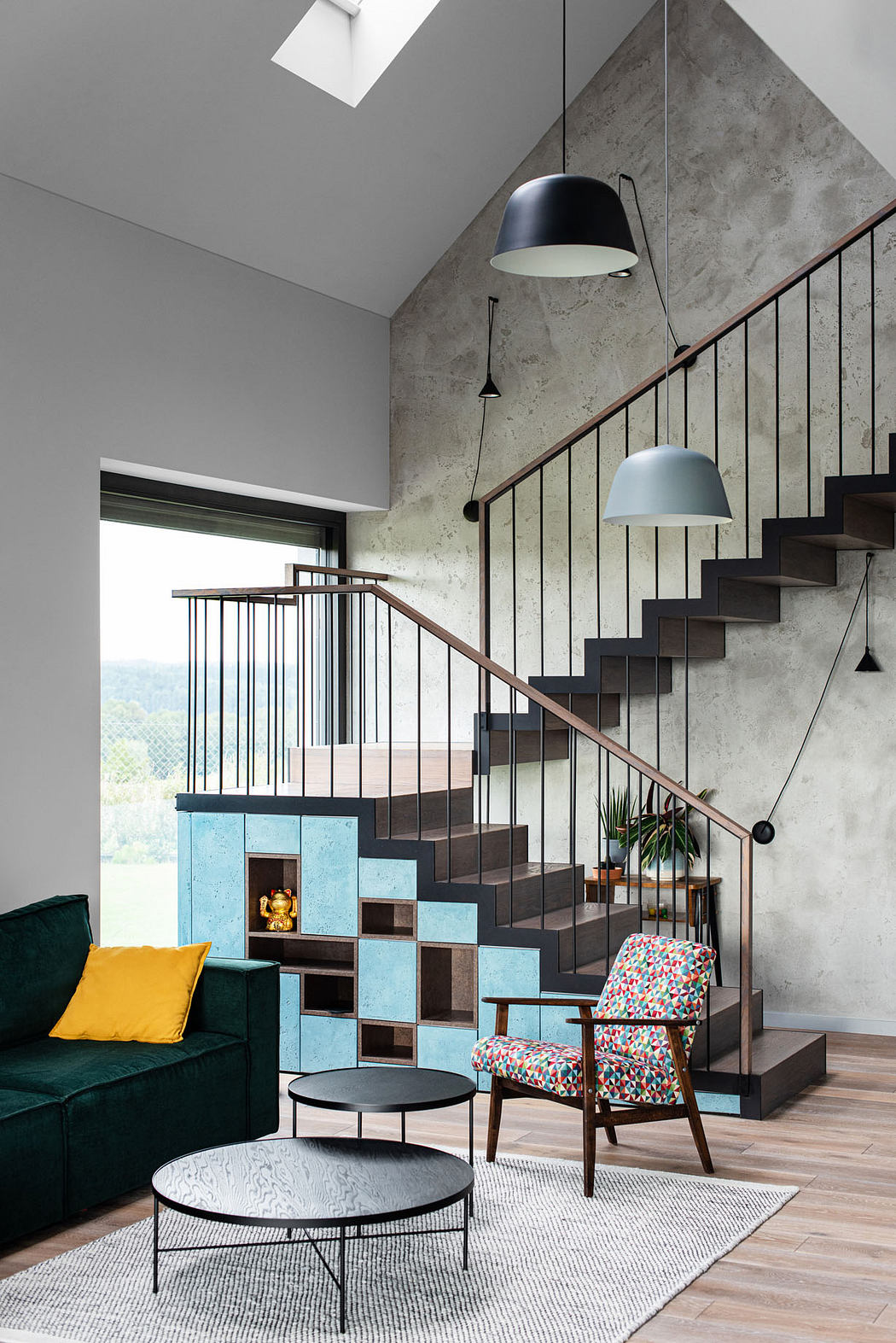 Modern staircase with geometric shelving and colorful furnishings. Sleek, minimalist design.