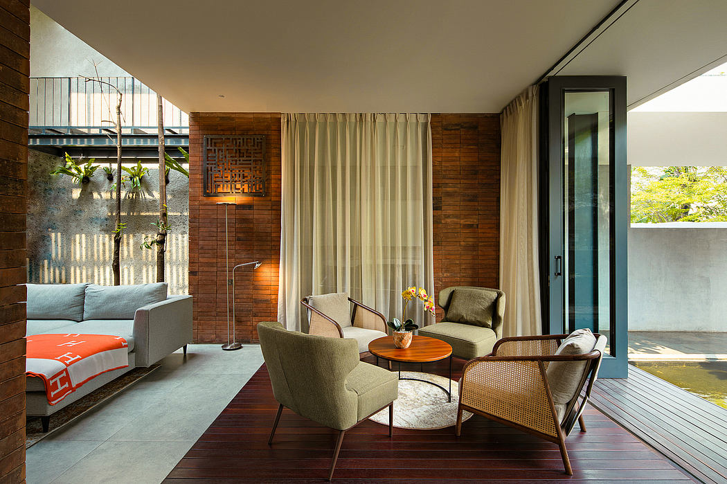 A cozy living space with warm wooden accents, modern furniture, and floor-to-ceiling curtains.