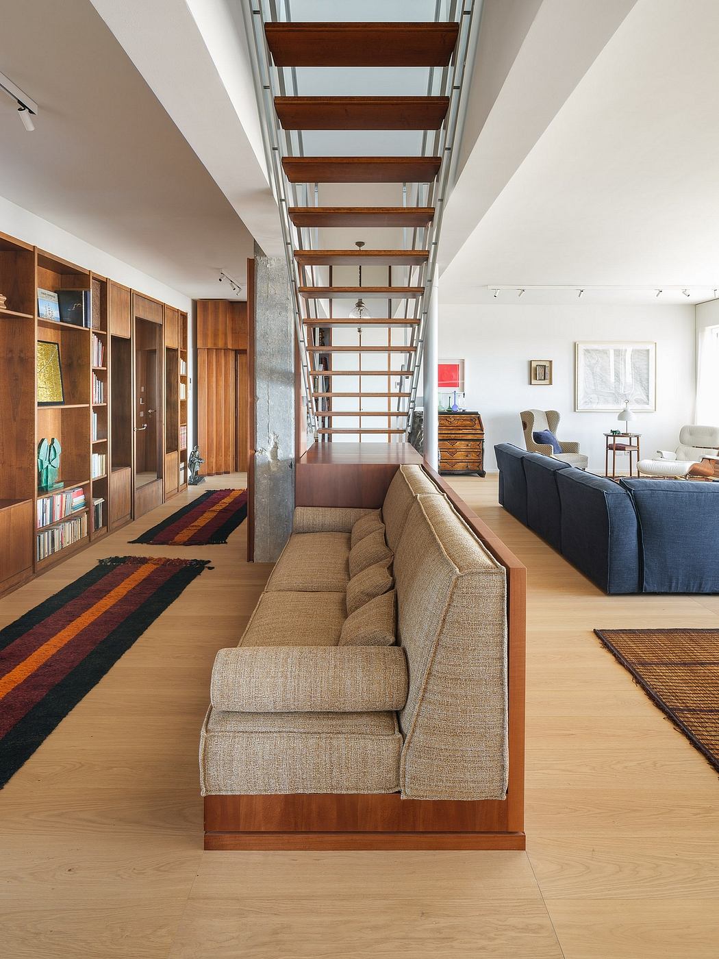 Elegant wood and glass architectural design with modern interior furnishings.