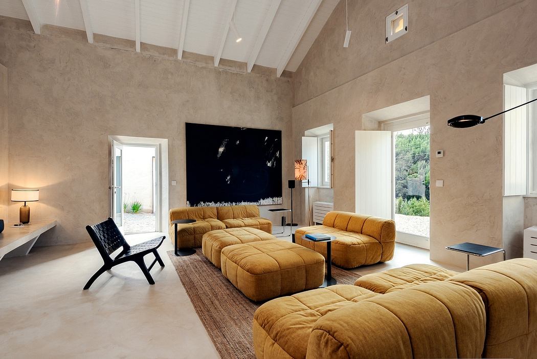 Spacious living room with high ceilings, cushy yellow sectional, and modern decor.