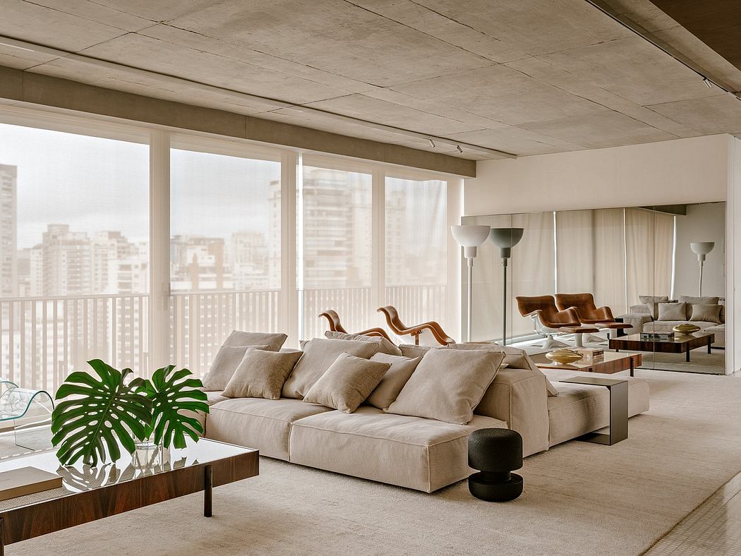 Spacious living room with floor-to-ceiling windows, plush beige sofa, and minimalist decor.
