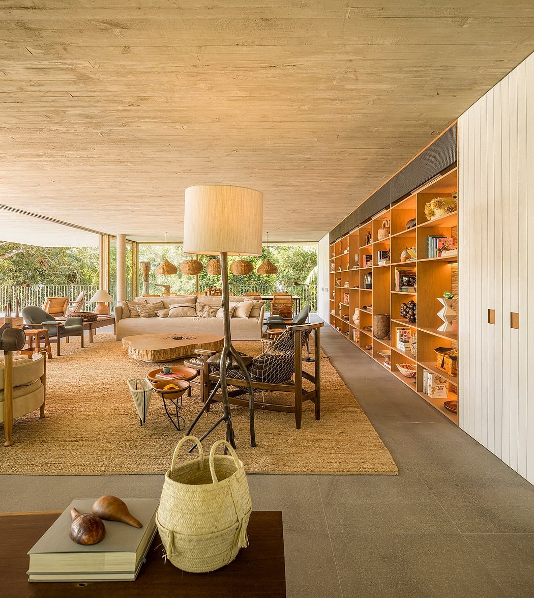 A cozy, rustic living room with wooden ceiling, built-in shelves, and earthy decor.