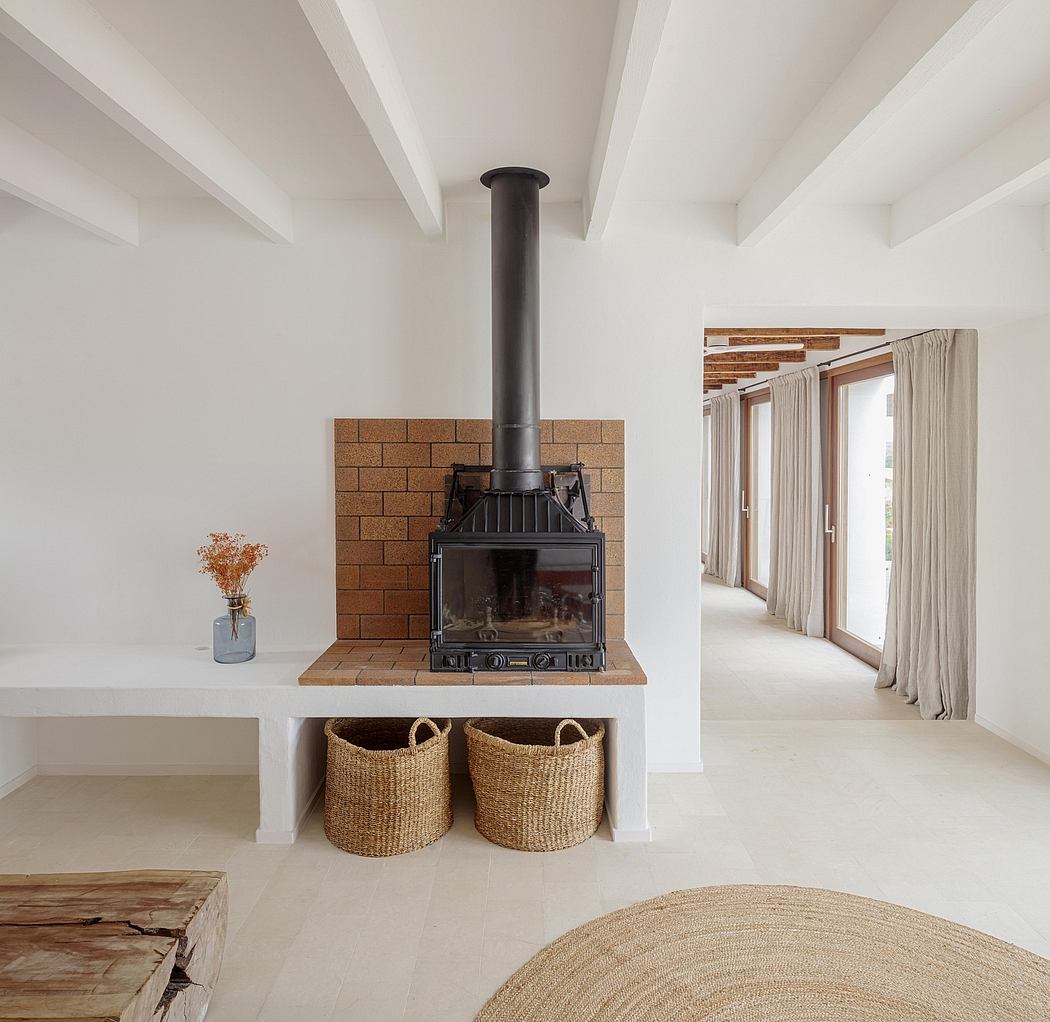 Modern living room with a cozy fireplace, natural textiles, and minimalist decor.