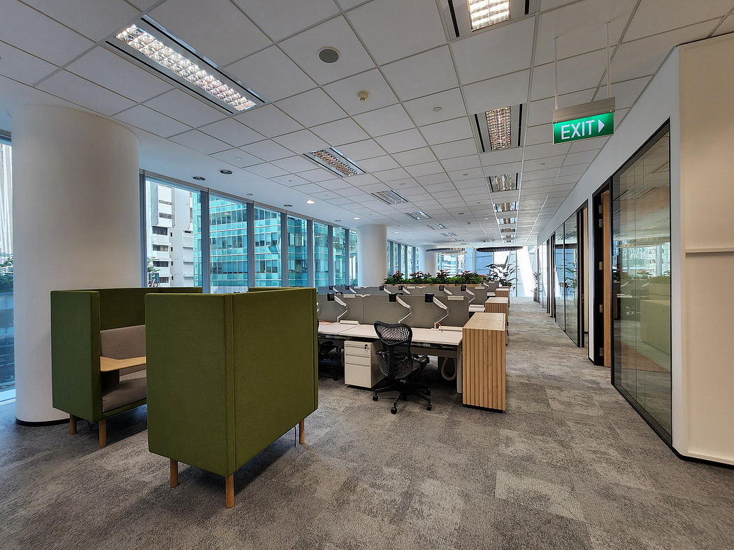 Modern office space with sleek lighting, modular furniture, and an open layout.