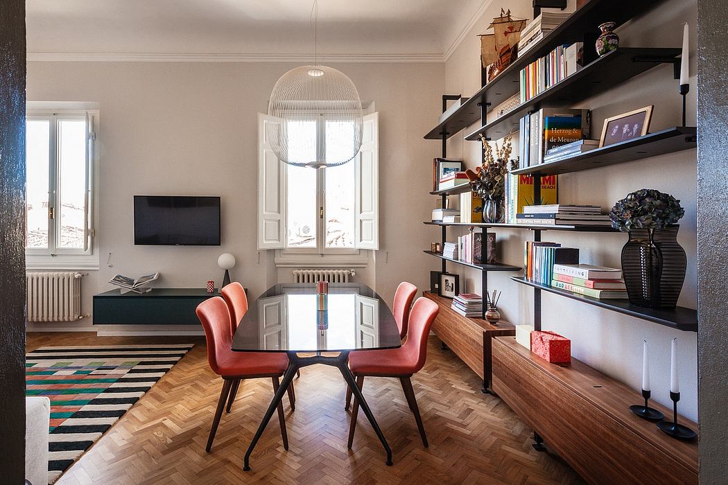 Elegant dining area with wood paneling, shelves, and colorful striped rug.