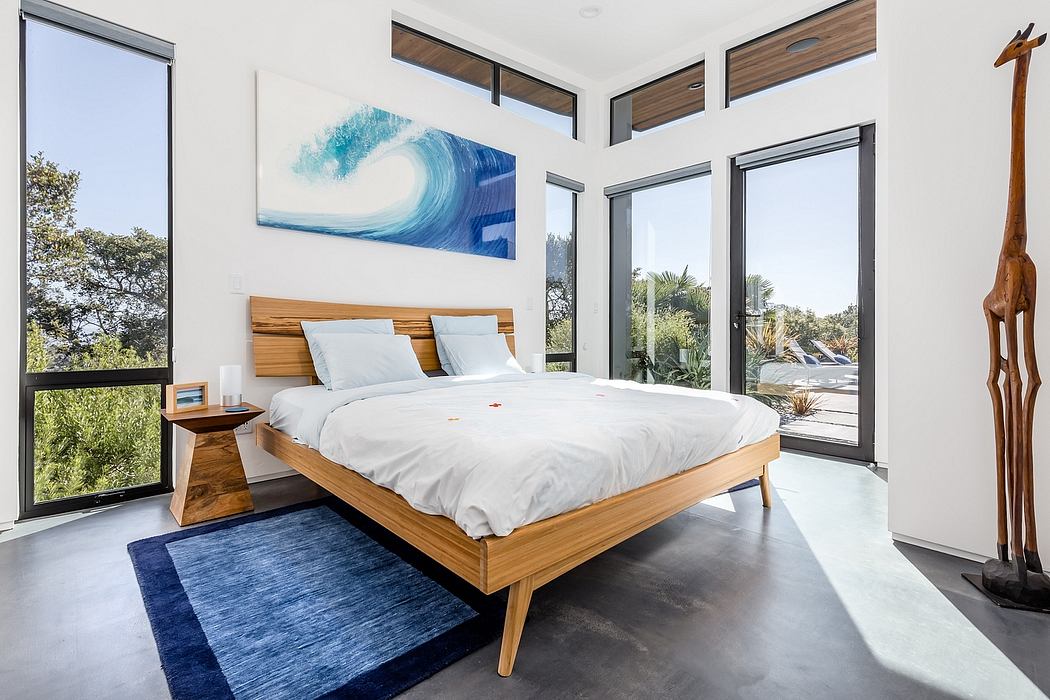 Modern bedroom with wooden bed frame, large wall art, and minimalist decor.