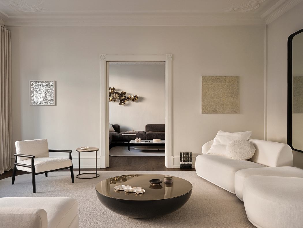 Elegant and minimalist living room with ornate ceiling, modern furnishings, and decorative accents.