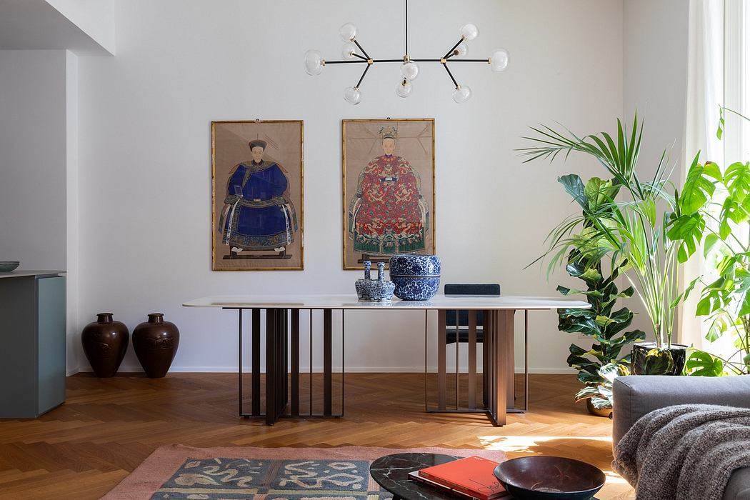 Elegant modern dining room with ornate Chinese artwork, lush plants, and minimalist furniture.