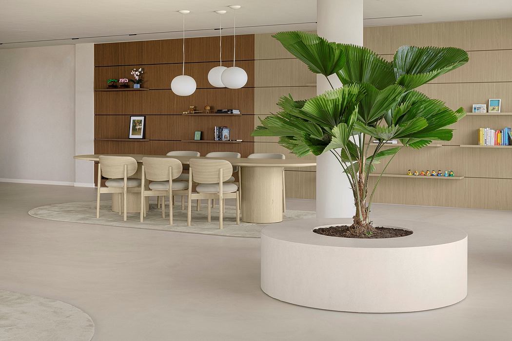 Sleek, modern interior with wood panels, pendant lights, and a large palm plant.
