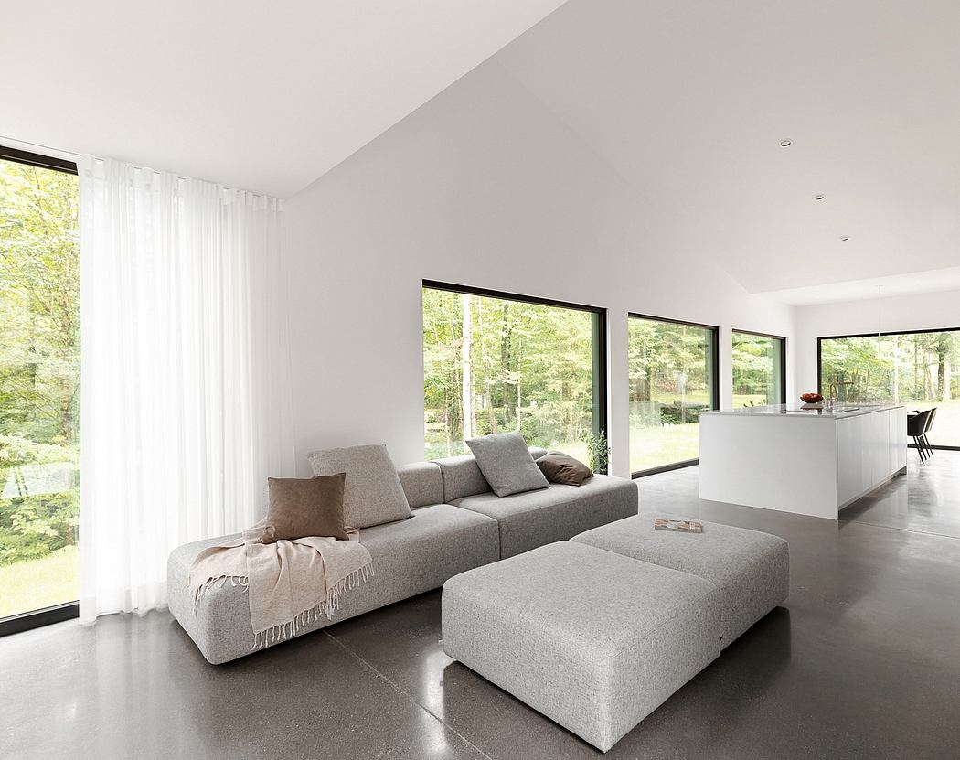 Minimalist living room with large windows, grey couch, and sleek, modern decor.