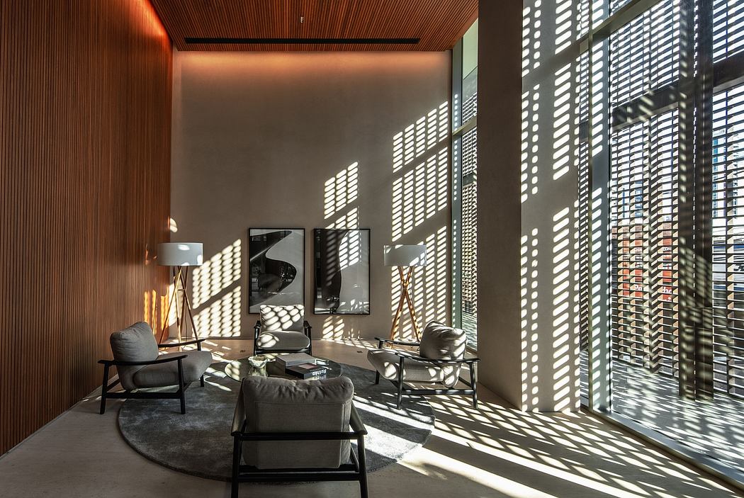 Modern living room with wooden walls, large windows, and intricate shadow patterns.