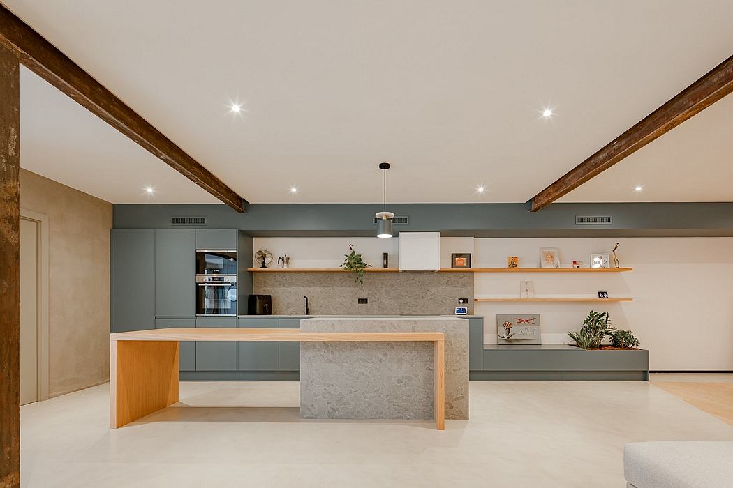 Spacious modern kitchen with wooden beams, stone countertop, and built-in shelving.