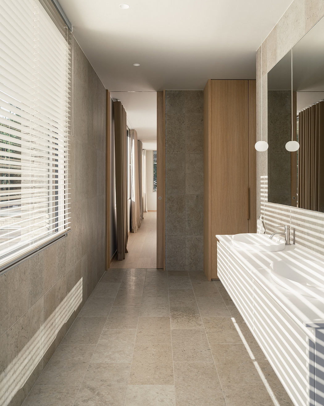 Sleek, minimalist bathroom with neutral tones, clean lines, and a modern vanity.