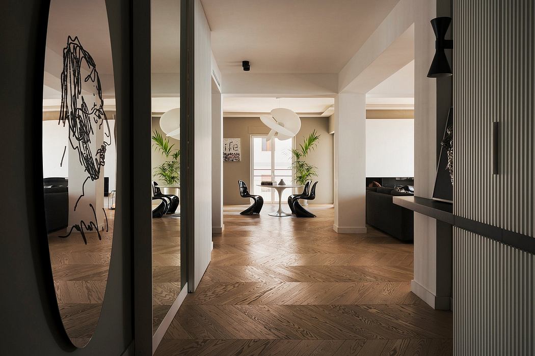 Elegant modern interior with distinctive herringbone wood flooring and minimal decor.