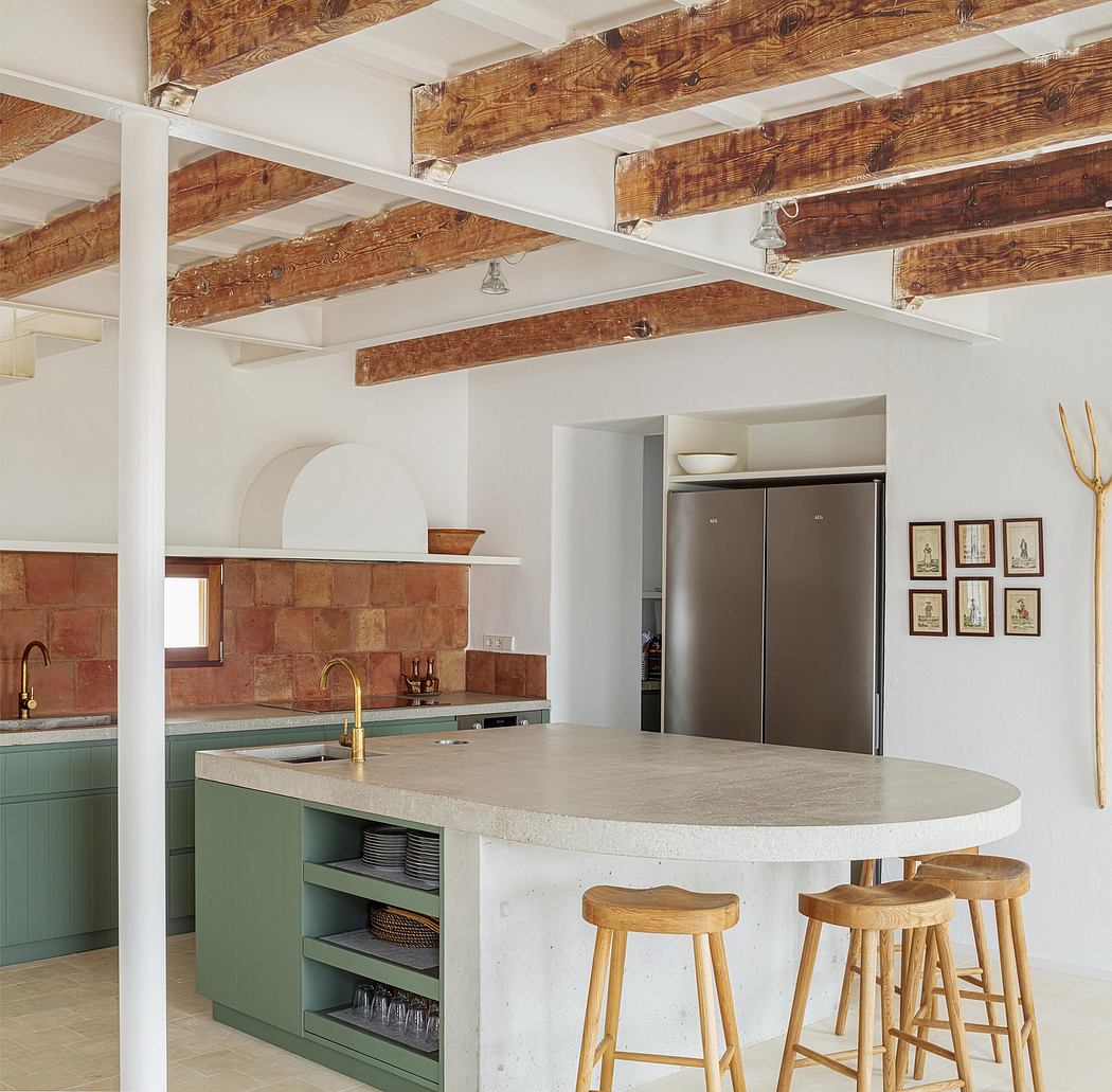 Rustic kitchen with exposed wooden beams, green cabinetry, and a curved concrete countertop.