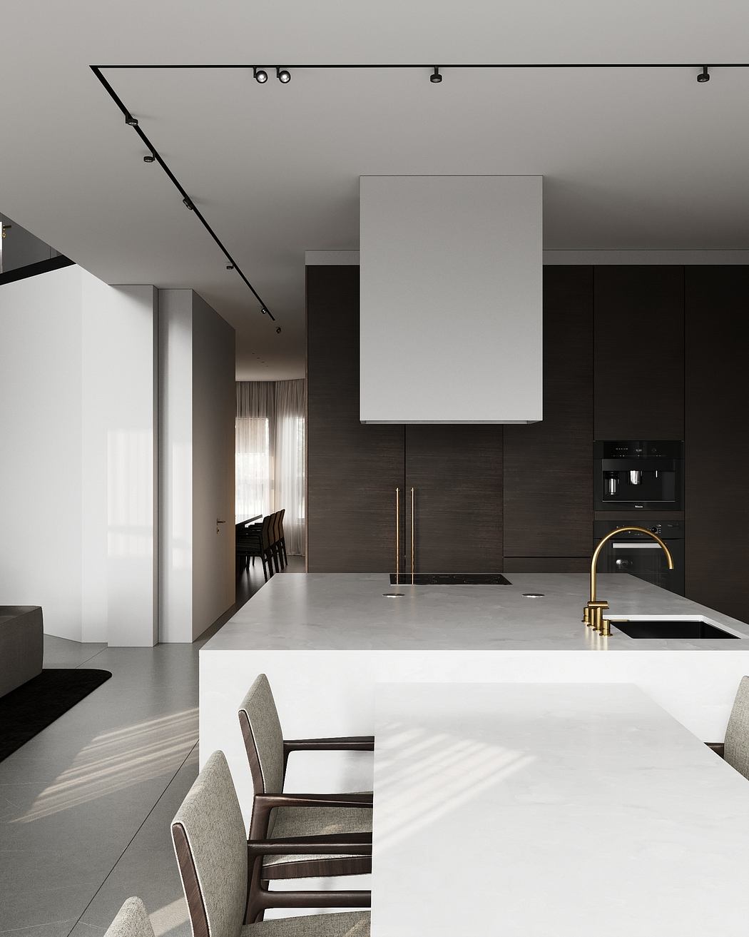 Sleek, modern kitchen with minimalist design, dark cabinetry, and a large white countertop.
