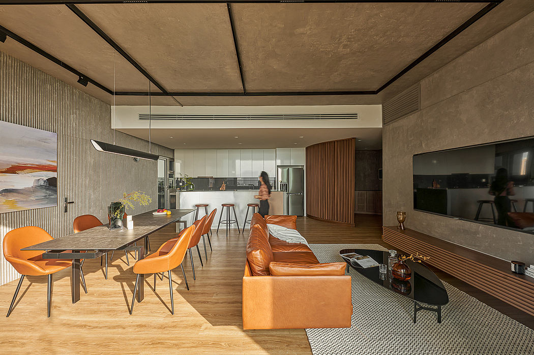 Spacious open-plan apartment with industrial-inspired design, warm wood tones, and modern furnishings.