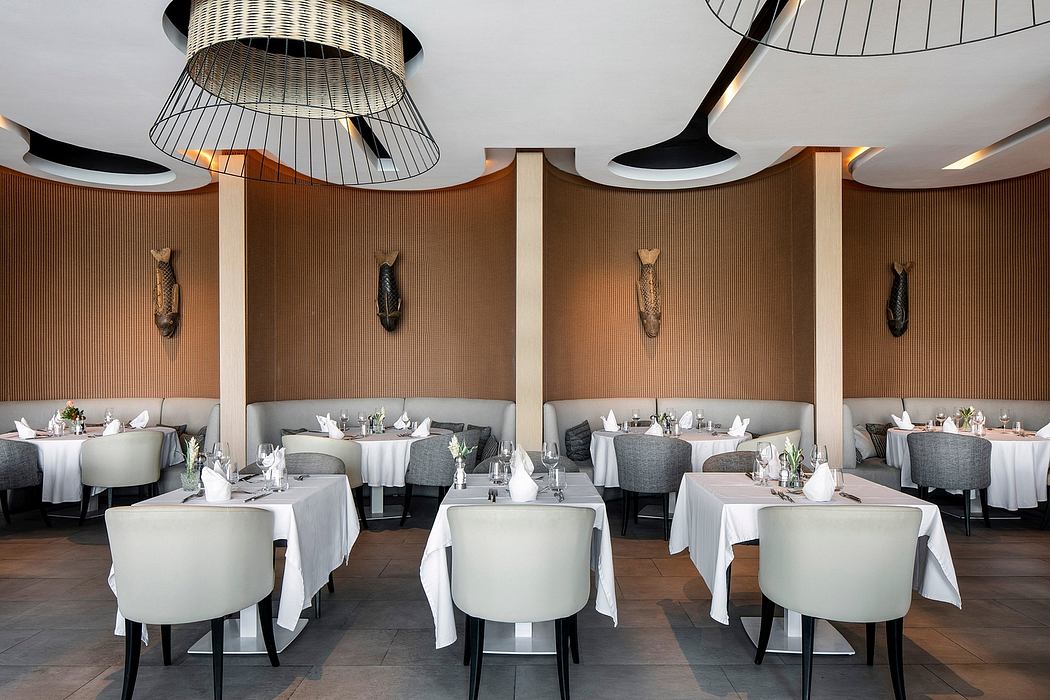 Elegant dining room with intricate lighting fixtures, textured walls, and modern furniture.