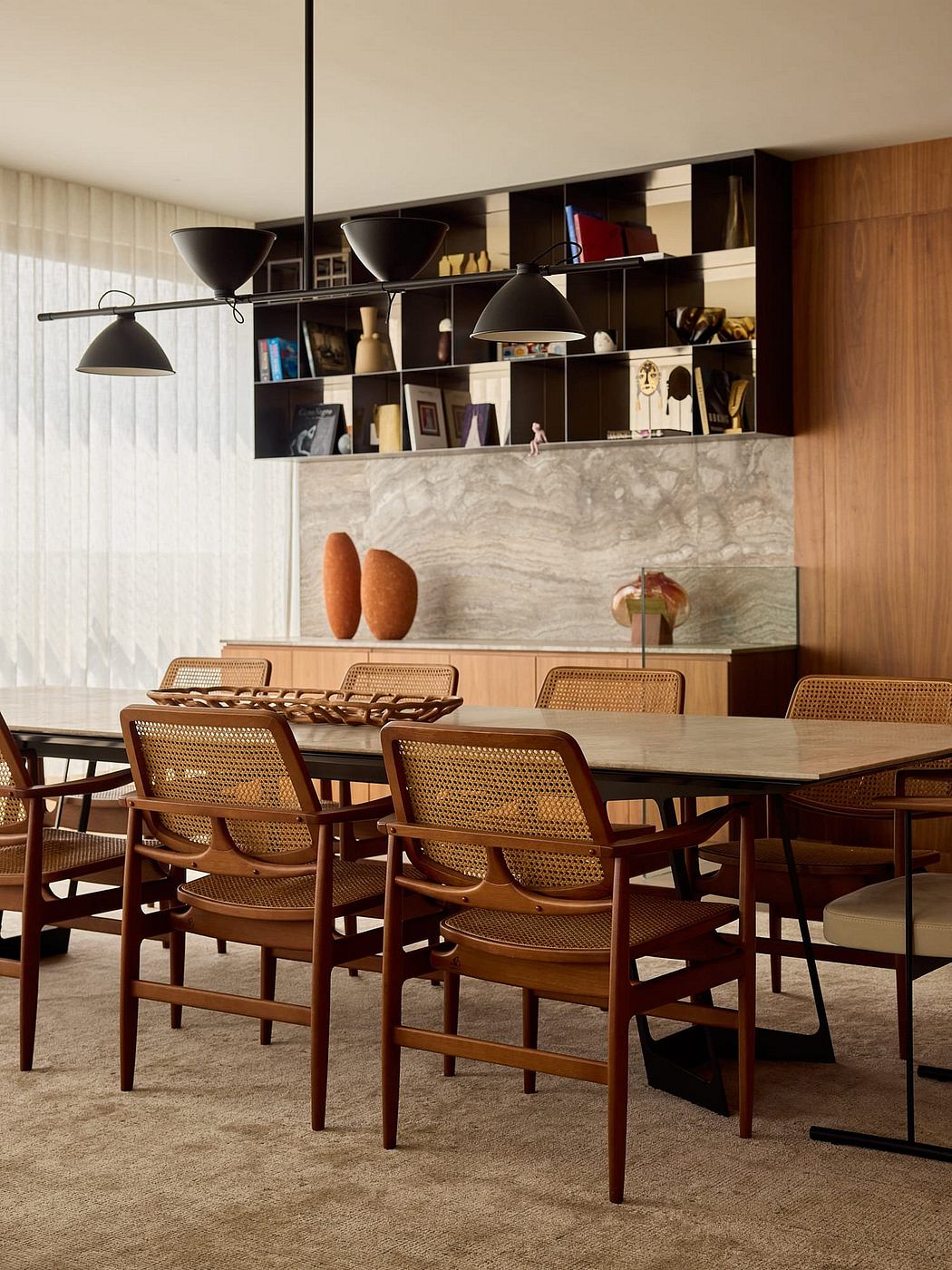Sleek modern dining room with wood and marble accents, showcasing a stylish aesthetic.