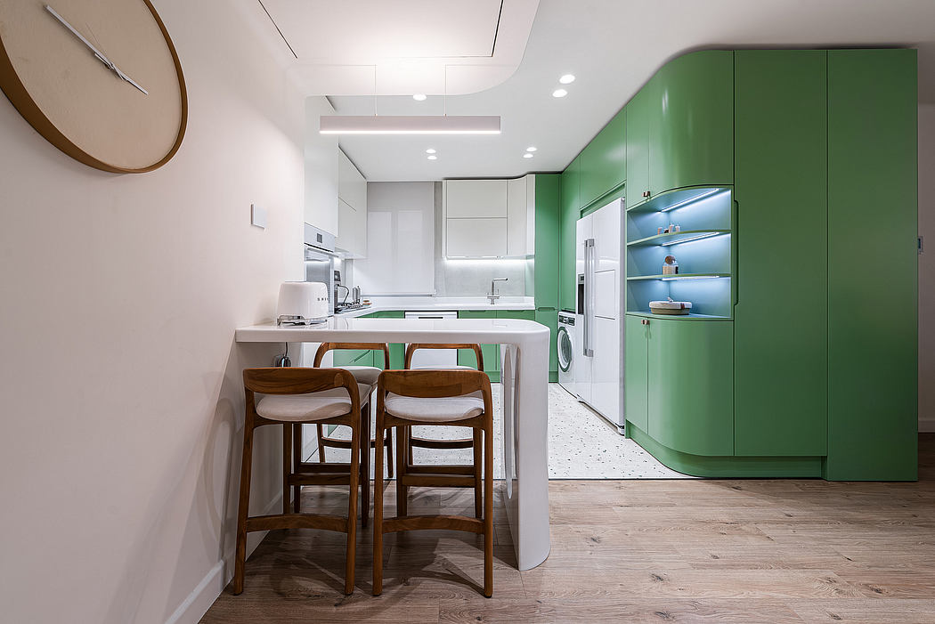 A modern kitchen with white and green color scheme, wooden accents, and open shelving.