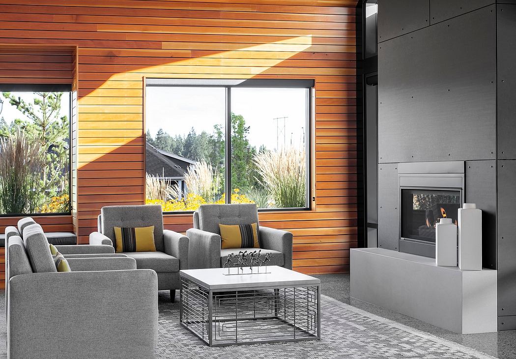 Vibrant wood paneling, modern furnishings, and a cozy fireplace create a warm, inviting space.